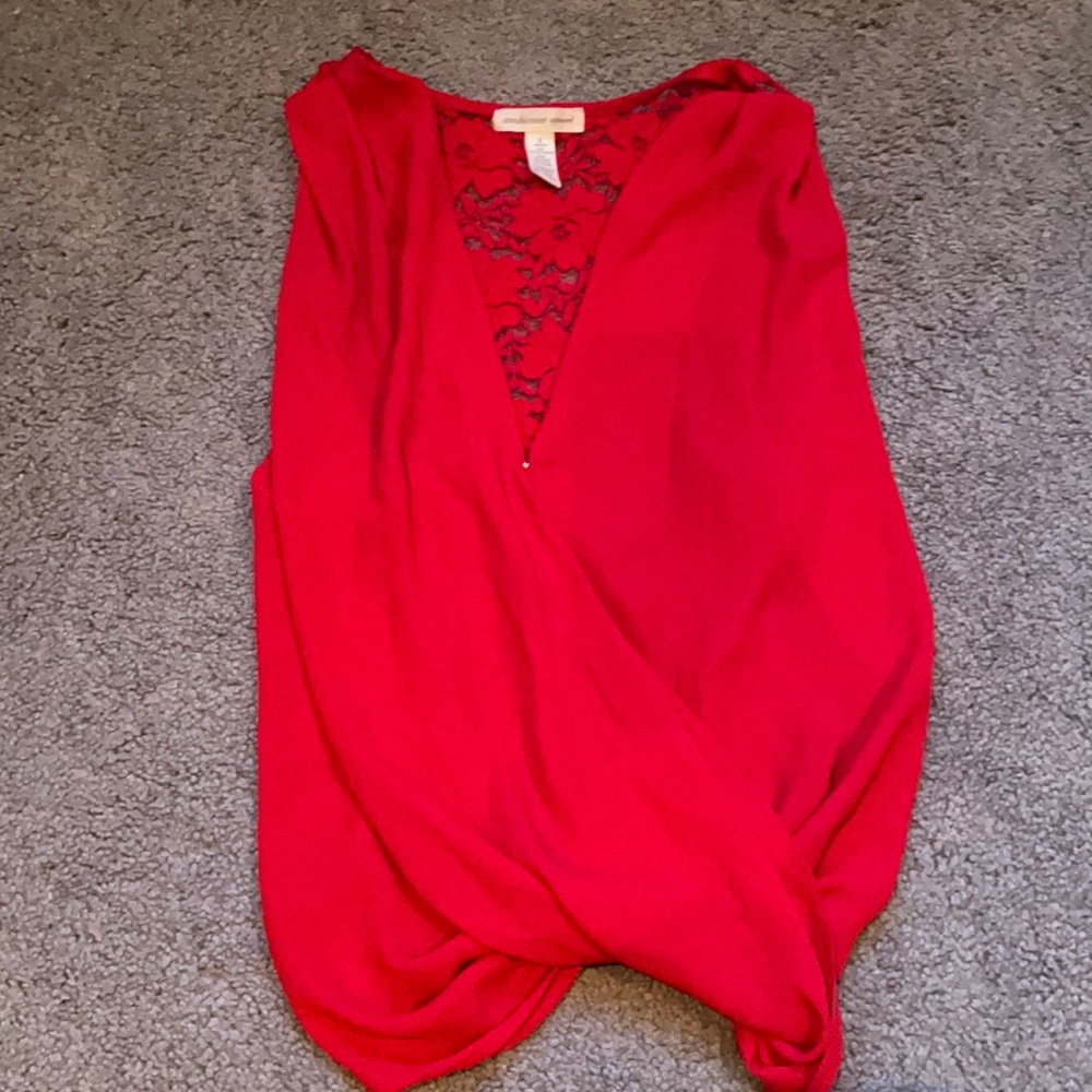 Red, sleeveless snap button shirt with racer back, sheer flowers on back